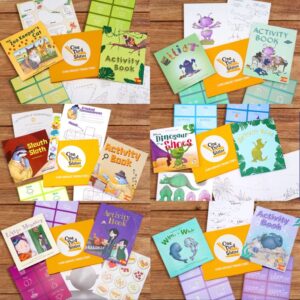 Various language learning books and materials laid out on a wooden table.