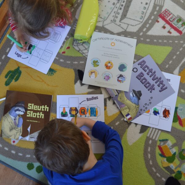 children using language learning books and activities