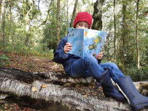 Child reading outside