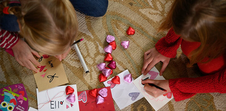 children making valentines day crafts